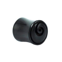 Load image into Gallery viewer, The Horn Plug schwarz Spirale is a black cylindrical organic expander with a carved spiral design, ideal as a tribal piercing Ohrstecker or tunnel, shown against a plain white background.
