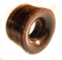 Cargar imagen en el visor de la galería, The Kokosnussholz Tunnel Scheiben is a dark brown, hand-carved Tribal Holztunnel Plug Expander with a smooth finish and natural wood grain—perfect as a unique body piercing accessory.
