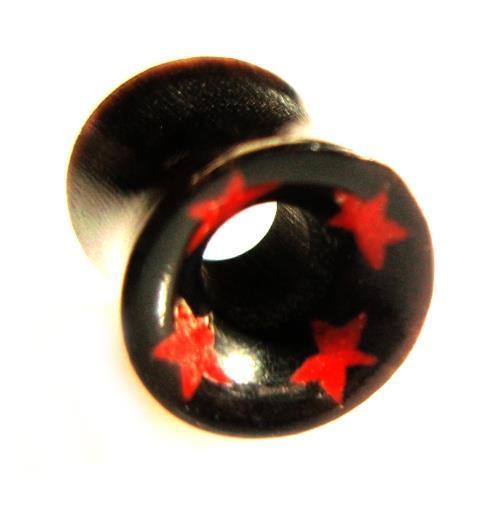 A Tribal Horn Tunnel schwarz Horntunnel Plug with red stars around the rim, featuring a hollow center and front pattern, is shown in black organic material from an angled view.