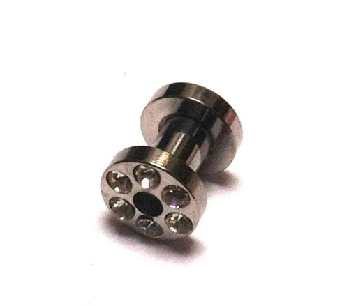 A silbergrau Metall Tunnel Expander aus Chirurgenstahl mit Strass Kristall Inlay und Glitzerstein-Design, Unisex Plug, auf weißem Hintergrund fotografiert.