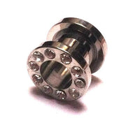 Load image into Gallery viewer, Der Metall Tunnel Chirurgenstahl Strass Kristall Inlay Unisex Plug in silbergrau präsentiert sich mit funkelndem Glitzerstein-Design und kleinen klaren Kristallen am Rand – abgebildet auf weißem Hintergrund.
