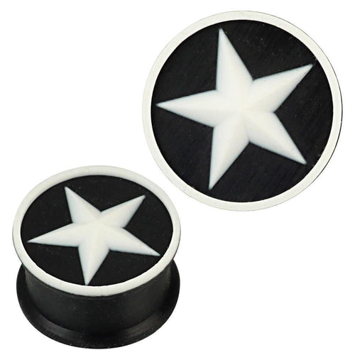 Two round Silikon Plug weich schwarz weiß with a raised edge, each featuring a white star design in the center. These stylish Piercing Ohrschmuck plugs are ideal as body jewelry or ear gauges.