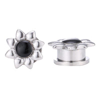 Load image into Gallery viewer, A pair of thin, silver stainless steel tunnel plugs with a flower shape and black center—Tunnel Plug Edelstahl Schraubplug Chirurgenstahl dünn silbern Blume Kern Schwarz—perfect for expressing your unique style.
