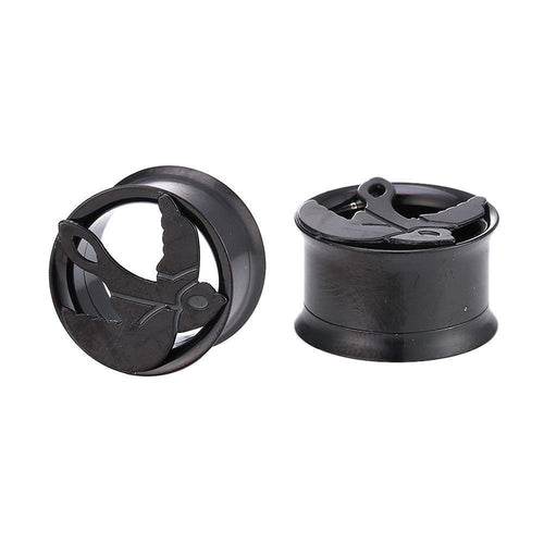 Two Tunnel Plug Edelstahl Schraubplug dünn schwarz plugs, each featuring a raised Friedenstaube motif with outstretched wings. One plug stands upright while the other lies on its side.