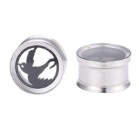 Load image into Gallery viewer, Two silver ear gauges: one with a flying dove cutout as the motiv Friedenstaube plug, the other shown from the side to display its sleek zylindrischer Tunnel shape. Both made from hochwertigem, silberfarbenem Edelstahl.
