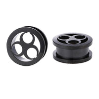 Cargar imagen en el visor de la galería, Two black Schraubplug Metalltunnel Tunnel Chirurgenstahl dünn Edelstahl Plugs, each with three large circular holes, are shown on a white background—one upright, the other flat, displaying both front and side views.
