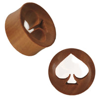 Load image into Gallery viewer, The Holz Tunnel rotbraun Pik ausgestanzt konkav double flared is a round wooden tunnel in reddish-brown, featuring a spade-shaped cutout and double-flared design, shown from an angle and top view to highlight its unique form.
