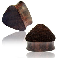 Load image into Gallery viewer, Two dark brown, triangular wooden ear plugs made from Narraholz, displayed on a white background—one upright and one lying down. An elegant "Triangle Plug Narraholz dunkel Pünktchen Expander Tunnel Tribal dreieckig" for stretched piercings.
