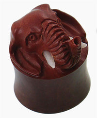 Load image into Gallery viewer, A brown carved wooden plug with a 3D elephant head, detailed ears, trunk, and bone-like tusks—Holz Plug braun Elefant Bone Stoßzähne plastisch Tunnel Tribal Expander Organic.
