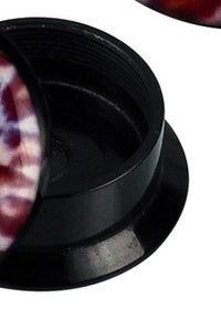 Load image into Gallery viewer, Close-up of a black, round Schraub Plug Acryl Leo Muster weiß braun Expander Piercing Ohrschmuck container, shown open with the patterned lid resting at an angle on top.
