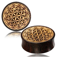 Load image into Gallery viewer, Two round Plug Holz Tamarinde Krokodilholz Blume des Lebens Zacken Rand plugs with engraved geometric flower patterns and interlocking lines, made from dark brown polished Krokodilholz for a natural, striking finish.
