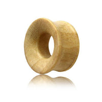 Load image into Gallery viewer, A light brown, ribbed Holz Flesh Tunnel Krokodilholz Plug with flared edge stands upright on a white background, its smooth surface subtly reflected—ideal for gedehnte Ohren.
