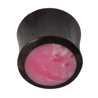 Load image into Gallery viewer, The Holz Plug Sonoholz features a dark wooden double-flared design with a smooth, slightly domed, shimmering pink resin inlay, shown against a white background.
