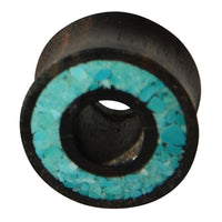 Load image into Gallery viewer, The Flesh Tunnel Eisenholz schwarz Rim Crushed Türkis Inlay is a round, dark wooden tunnel with a central hole and a rim featuring striking turquoise stone inlays for a bold tribal look.
