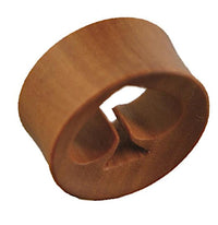 Load image into Gallery viewer, The "Holz Tunnel rotbraun Pik ausgestanzt konkav double flared" is a brown, cylindrical, double flared wooden plug featuring a heart-shaped cutout, shown on a white background.
