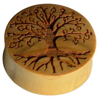 Load image into Gallery viewer, The Krokodil Holz Plug Baum des Lebens hell double flared is a round earplug engraved with a detailed tree of life design, showcasing intricate branches and roots across its surface.
