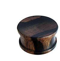 Load image into Gallery viewer, The Tigerholz Plug dunkelbraun schwarz Holzplug ribbed is a round, dark brown and black wooden ear gauge with ribbed detail, shown against a white background.
