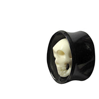 Load image into Gallery viewer, A black oval Horn Plug "Totenkopf Bone Inlay" Flesh Tunnel features a striking white skull design, crafted from organic material, perfect as an expander or tribal piercing jewelry.
