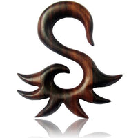 Load image into Gallery viewer, The Sonoholz Tribal Piercing Holz S-Form Spitzen Unisex Expander is a hand-carved, organic wooden decorative piece shaped like an abstract S with pointed, wave-like extensions, shown against a white background.
