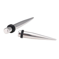 Load image into Gallery viewer, Piercing Spike Expander Edelstahl silbern Ohrstecker zwei Gummiringe schwarz
