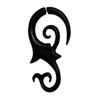Load image into Gallery viewer, A large, hand-carved fake piercing made from dark brown ebony and stainless steel, featuring tribal curves—ideal as a Dehner or stylish accessory for stretched piercings.
