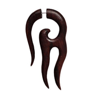 Load image into Gallery viewer, A handgeschnitzte Fake Piercing aus Sonoholz und Edelstahl in groß, mit hell-dunkelbrauner Tribal-Optik sowie drei gebogenen, spitzen Prongs und Metallstab oben als Dehner.
