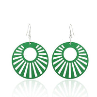 Load image into Gallery viewer, The "Holzohrringe bunt 5 cm rund Kreis Strahlen Ohrringe Holz Ohrhänger Organic Damen" are green, round wooden dangle earrings with sunburst cut-out patterns and nickelfree silver hooks for comfortable wear.
