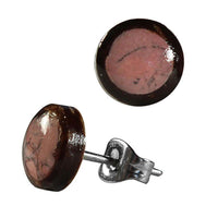 Load image into Gallery viewer, A pair of unisex 8 mm round stud earrings made from coconut wood and stainless steel, featuring a shell stone inlay with a star design, securely attached to silver metal posts and butterfly backings.
