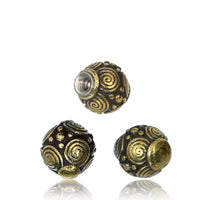 Load image into Gallery viewer, Three round, dark metal Kugel Bauchnabelpiercing Brass Edelstahl gold beads with intricate gold spiral and dot patterns are shown on a white background. One bead has a threaded hole, ideal for use as a piercing ball for navel jewelry.
