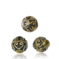 Load image into Gallery viewer, Three round Kugel Bauchnabelpiercing Brass Edelstahl gold beads with retro vintage Muster and antique gold swirls on a dark background, each displayed from a different angle to show the intricate design.
