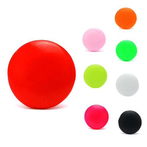 Eight colorful brass star-shaped earrings are arranged on a white background. The largest red earring is on the left, while the smaller, nickelfrei stainless steel studs cluster on the right, evoking a playful, unisex style.