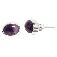Load image into Gallery viewer, A pair of Silberohrstecker oval Ohrringe for Damen, crafted from 925er Sterling Silber with polished purple Edelstein. One earring is shown from the front, the other angled to display the side and post.
