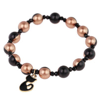 Load image into Gallery viewer, Armband Brass golden schwarz halb Perlen Kristalle Katze Charm verstellbar - chic - net.de
