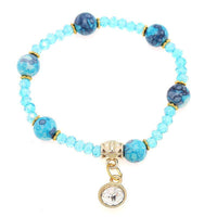 Load image into Gallery viewer, Armband Brass golden Zirkonia Charm Kristalle Perlen marmoriert blau verstellbar - chic - net.de
