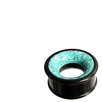 Load image into Gallery viewer, The Holz Tunnel türkis schwarz crushed Stein Inlay Eisenholz is a unisex plug tunnel featuring a vibrant türkis crushed stone inlay on the outer edge, shown against a white background.
