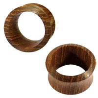 Load image into Gallery viewer, Two brown Teakholz Flesh Tunnel braun double flared Plugs are shown from different angles on a white background, highlighting the visible wood grain that gives each plug a natural, textured look.

