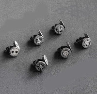 Load image into Gallery viewer, Six pairs of round black and silver cufflinks with clock face designs are arranged in two rows on a textured gray surface, evoking the stylish look of Edelstahl Ohrstecker schwarz 8-10mm Viking Celtic Nordic.
